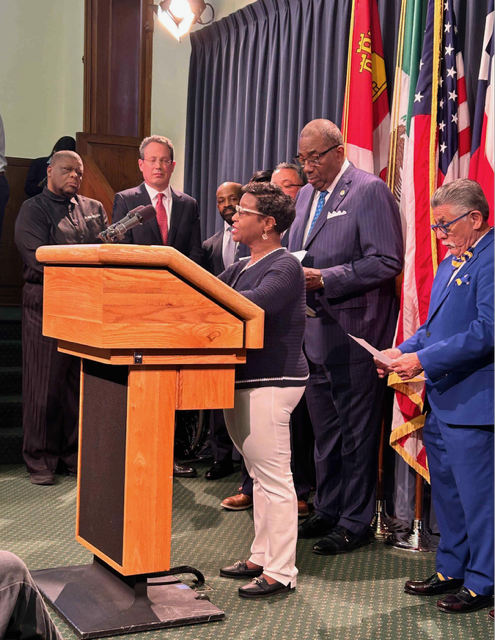 Cortena Williams at a podium during The Texas HUB Case press conference